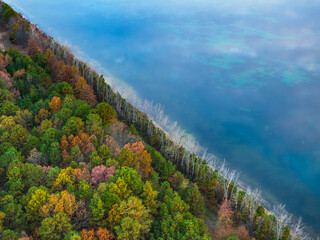 Fall colored trees along the water