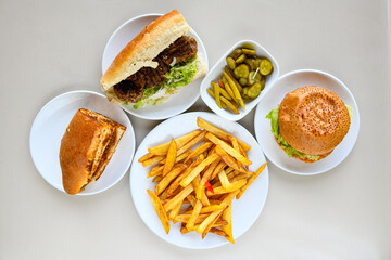 Table scene of assorted take out or delivery foods. Traditional Turkish cuisine. Various Turkish meal and appetizers. Top down view on a table.