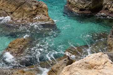 turquoise sea water and rocks on the Mediterranean coast scenic seascape nature background