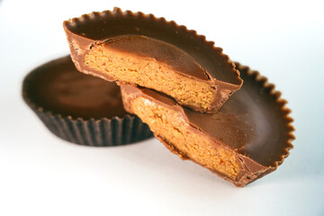 Macro shot of Peanut butter filled candy with chocolate frosting isolated on white background