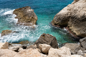 rocks and turquoise sea water on the Mediterranean coast scenic seascape nature background