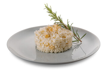 Rice seasoned with fresh cheese and parmesan pieces and rosemary sprig in plate isolated