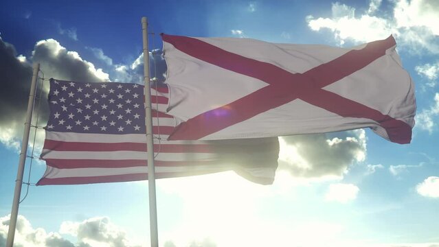 The flags of the Alabama state and United States of America waving in the wind. American state. Concept of democracy and independence
