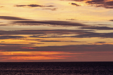 sunrise on the sea, Image shows the moments before the sun rises over Dovercourt beach in the early hours of the morning giving a beautiful golden glow, taken October 2023