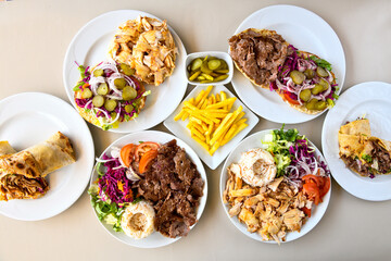 Table scene of assorted take out or delivery foods. Traditional Turkish cuisine. Various Turkish meal and appetizers. Top down view on a table.