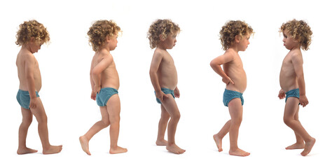 various poses of same boy in underpants walking on white background (3 year old)