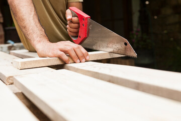 Carpenter cutting board with saw