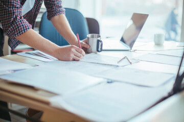 Male hands sketching in office