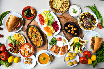 Table scene of assorted take out or delivery foods. Traditional Turkish cuisine. Various Turkish meal and appetizers. Top down view on a table.