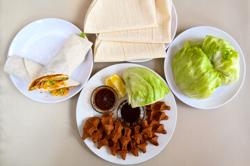 Table scene of assorted take out or delivery foods. Traditional Turkish cuisine. Various Turkish meal and appetizers. Top down view on a table.