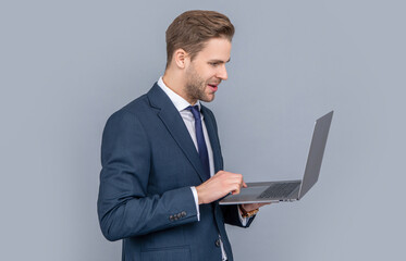 Man has online blog. Businessman in suit with laptop in office chair. Remote online working. Business blog success. Businessman isolated on white. freelancer working online. typing on laptop