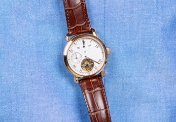 Luxury life and success. Male fashion accessory. Expensive hand watch. Leather wristwatch on blue. Deadline or time management. Mens wristwatch. For rich and successful