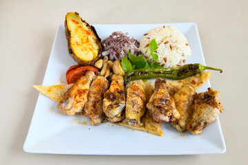Chicken wings barbeque in a dish with BBQ grill sauce . Izgara tavuk kelebek sis kanat. Tavuk sis, gogus.