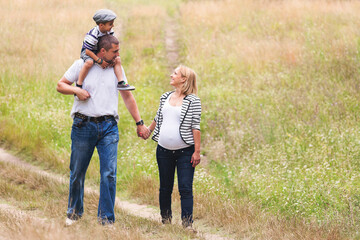 Happy family walking in nature