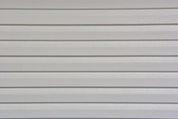 Gray aluminum texture wallpaper. Diagonal perspective.