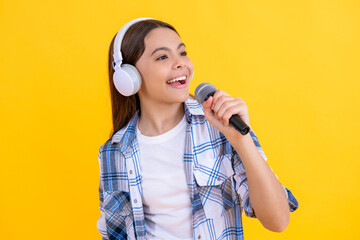 glad singer girl singing music on background. singer girl with microphone in music studio. talented...