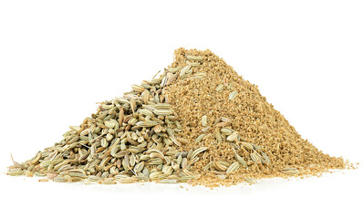 Pile of ground fennel and fennel seeds isolated on a white background