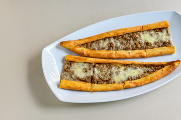 Kiymali pide.Turkish pide with minced meat. Turkish pizza mince pita Pide on white background. Etli ekmek. Kusbasi kasarli, kiymali kasarli, kiymali yumurtali,  tirnak Trabzon, Bafra, Kusbasili pide.