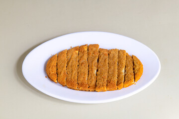 Fried Chicken breast hot crispy strips crunchy chicken tenders  isolated on white background.Nuggets isolated on white background on a plate