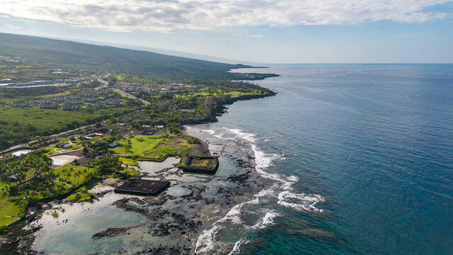Drone photos off the the Big Island, Hawaii along the coast line with a beautiful blue sky and water