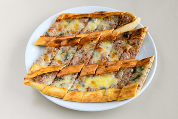 Kiymali pide.Turkish pide with minced meat. Turkish pizza mince pita Pide on white background. Etli ekmek. Kusbasi kasarli, kiymali kasarli, kiymali yumurtali,  tirnak Trabzon, Bafra, Kusbasili pide.