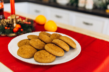 Cozy flat apartment photo studio room green Christmas Tree gifts presents garlands, candles decorated toys balls interior New Year lights glowing bokeh, cookies, soda, tangerines
