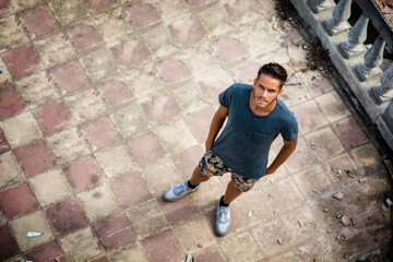 A man is standing on a brick walkway. Photo of a man standing on a brick walkway with mesmerizing...