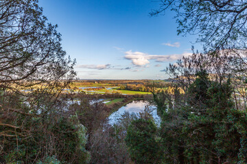 Fields flooded from heavy rain, near Lewes in East Sussex, with a blue sky overhead