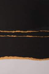 Gold, bronze and black paper painting wall. Abstract glow texture copy space relief background.