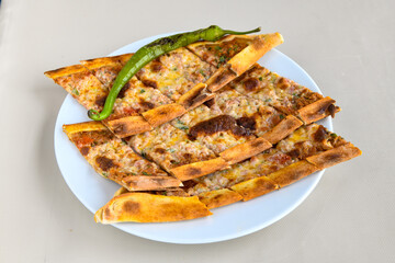 Kiymali pide.Turkish pide with minced meat. Turkish pizza mince pita Pide on white background. Etli ekmek. Kusbasi kasarli, kiymali kasarli, kiymali yumurtali,  tirnak Trabzon, Bafra, Kusbasili pide.