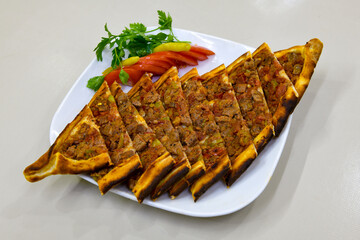 Kiymali pide.Turkish pide with minced meat. Turkish pizza mince pita Pide on white background. Etli ekmek. Kusbasi kasarli, kiymali kasarli, kiymali yumurtali,  tirnak Trabzon, Bafra, Kusbasili pide.