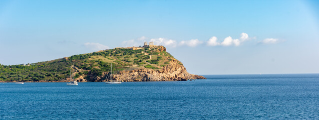 Cape Sounion in Attica, Greece, turquoise Aegean Sea, ancient Temple of Poseidon, rocky cliffs
