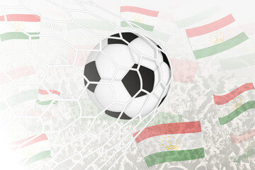 National Football team of Tajikistan scored goal. Ball in goal net, while football supporters are waving the Tajikistan flag in the background.