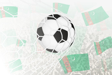National Football team of Turkmenistan scored goal. Ball in goal net, while football supporters are waving the Turkmenistan flag in the background.