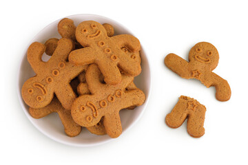 Gingerbread man in ceramic bowl isolated on white background. Top view. Flat lay.
