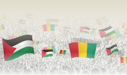 Palestine and Guinea flags in a crowd of cheering people.