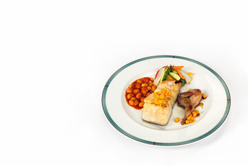 grilled sea bass loin and quail thighs with beans, mango and vegetables, isolated on a white background and space for text or design