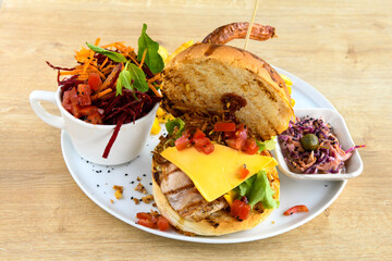 Big tasty burger with beef cutlet on a plate. Crispy chicken burger.