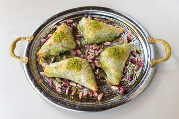 Turkish Dessert Sobiyet  Baklava, mussels baklava and classic baklava with Pistachio . Cevizli, Fistikli Baklava, top view.