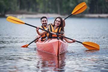 Foto op Canvas Couple travelling by kayak © georgerudy