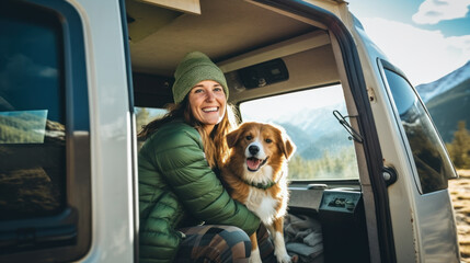 happy dog with owner sitting in their camper van