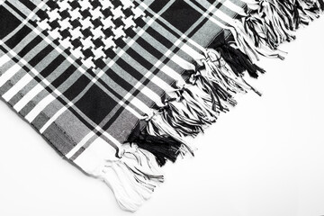 A traditional head-tied garment 'Keffiyeh' or 'Puşi' on a white isolated background. Keffiyeh is...