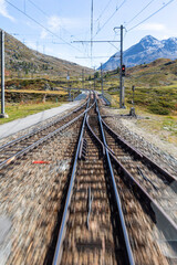 Swiss Bernina Express railway line crosses the Alps - 674133067