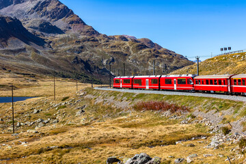 Swiss Bernina Express railway line crosses the Alps - 674133287