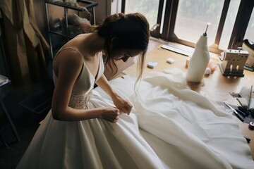 Confection de robes de mariée. Wedding dresses tailoring. - obrazy, fototapety, plakaty