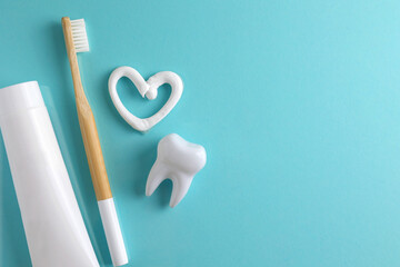 Toothpaste heart on a colored background. Dental care, oral health.
