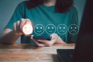 Client's hand ticked the happy smile face, Customer service evaluation and satisfaction survey...