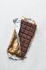 dark chocolate bar for baking on a chopping board, Dark chocolate about to chopped into pieces