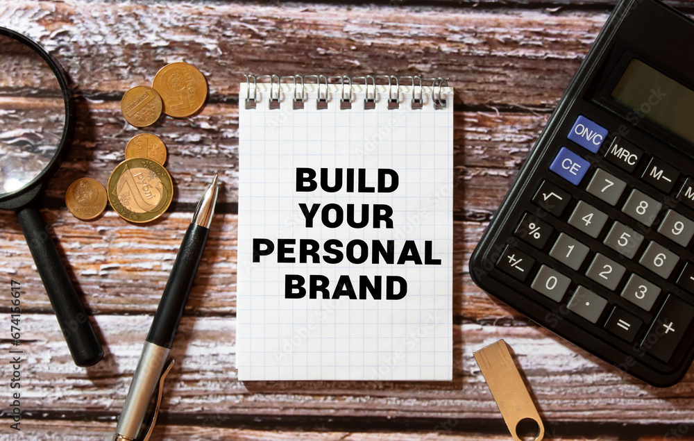 Poster note with a fountain pen on a notebook. text take time to build your brand