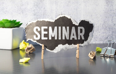 Hand writing Seminar topic on chalkboard